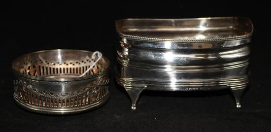 A George III silver cruet stand base, London 1807, (lacking fitments) and a later circular pierced wine coaster, Thomas Bradbury & Sons